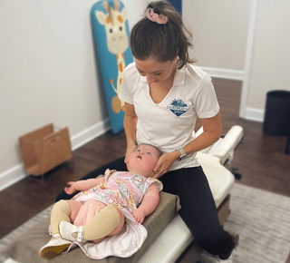 Gentle pediatric chiropractic care for an infant at Charleston Chiropractic Studio in Charleston, SC